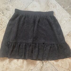 Cute skirt. LOFT brand. Flattering ruffle at bottom. Dark brown and tan.